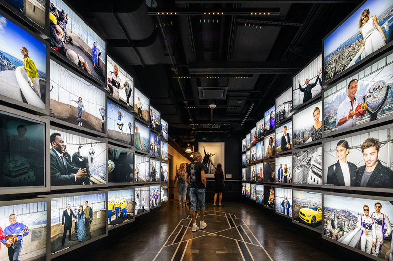 The experience on the second floor includes a gallery of celebrity visitors to the Empire State Building, leading to the elevator to the observation deck. Credit - Mark Wickens for The New York Times The experience on the second floor includes a gallery of celebrity visitors to the Empire State Building, leading to the elevator to the observation deck. Credit - Mark Wickens for The New York Times