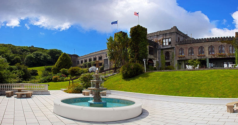 Abbeyglen Castle, nestled amongst emerald greenery in Galway