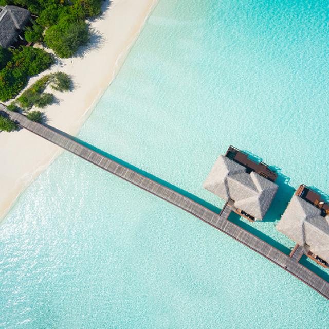 Overwater villas in tropical lagoon